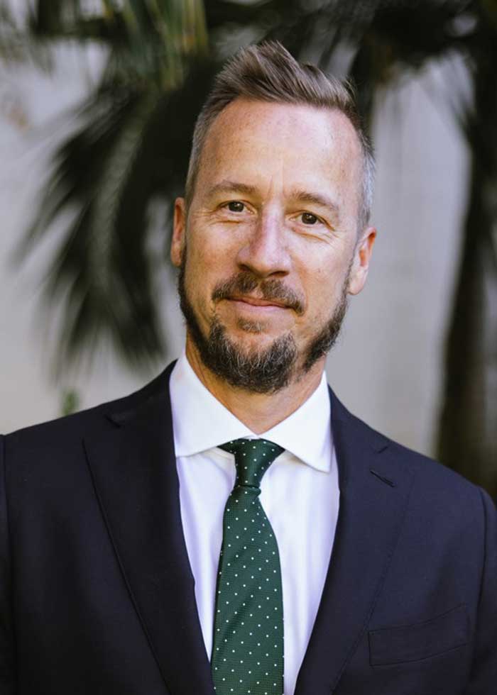 Attorney Lawrence J. Conlan appears in a headshot photo outside Santa Barbara courthouse.